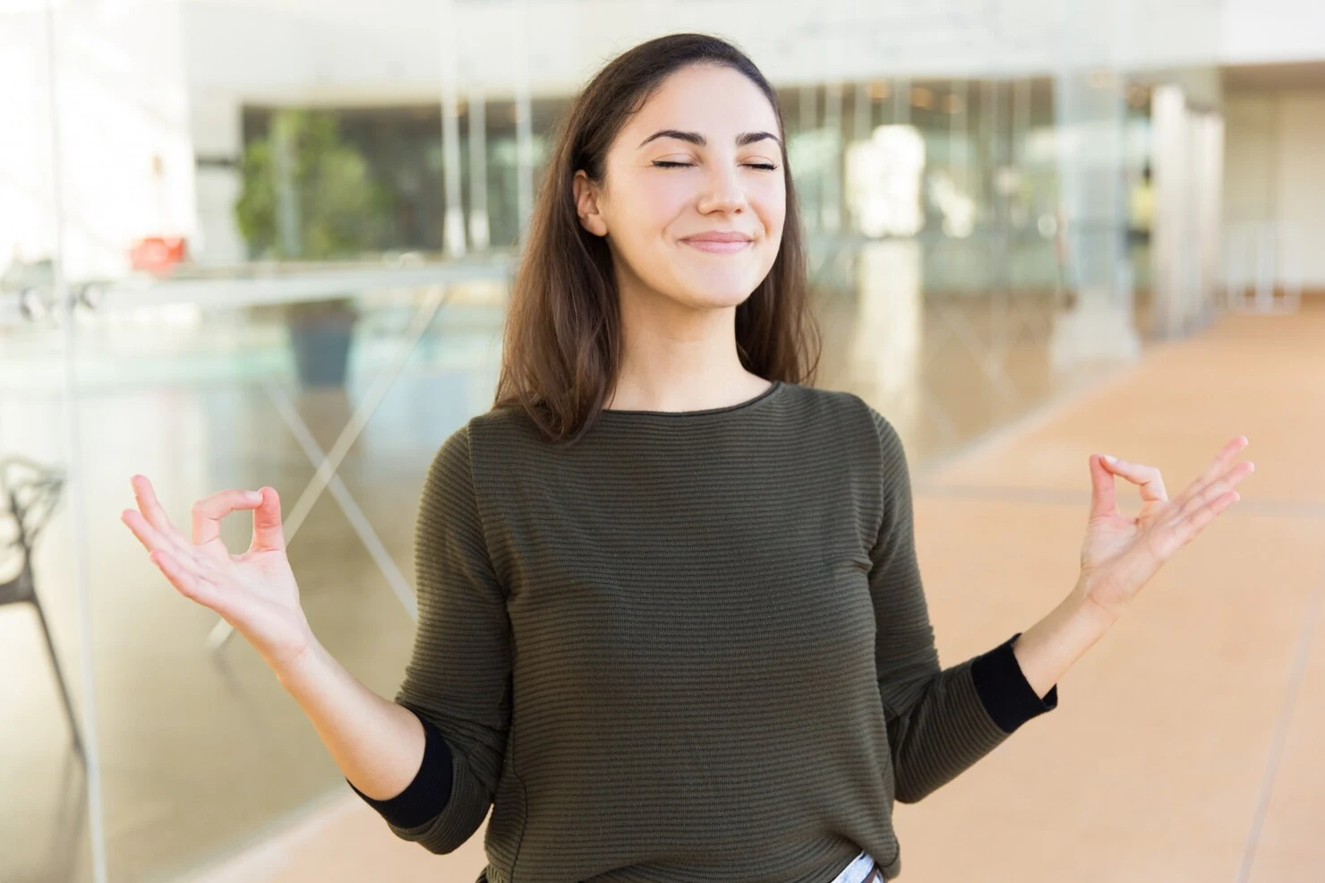 peaceful-smiling-beautiful-woman-making-zen-gesture_74855-3006